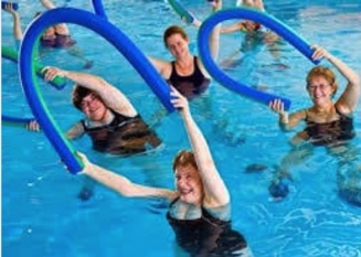 pensioners doing hydrotherapy exercises with weights in pool
